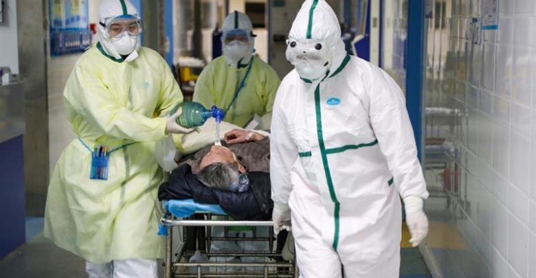Coronavirus victim being taken away (Photo credit- Al-Jazeera)