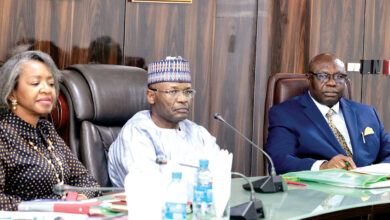 Prof. Mahmud Yakubu and two of INEC's federal commissioners