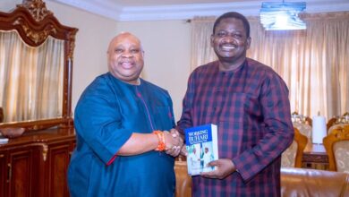 Femi Adesina and Governor Ademola Adeleke during the presentation