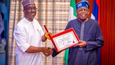 Monday Okpebholo presenting his certificate of return to Tinubu